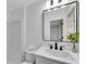 Modern bathroom with black faucet and framed mirror at 4309 King Valley Se Dr, Smyrna, GA 30082