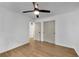 Spacious bedroom with wood floors, ceiling fan, and doorways to bathroom and closet at 4309 King Valley Se Dr, Smyrna, GA 30082