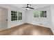 Well-lit bedroom with hardwood floors and window views at 4309 King Valley Se Dr, Smyrna, GA 30082