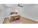 Cozy bedroom with light wood floors, ceiling fan, and neutral decor create a relaxing retreat at 4309 King Valley Se Dr, Smyrna, GA 30082