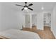 Bright bedroom features modern ceiling fan, hardwood floors, and doorways to bath and closet at 4309 King Valley Se Dr, Smyrna, GA 30082