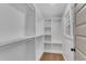 Spacious walk-in closet with custom shelving and natural light, perfect for organized storage at 4309 King Valley Se Dr, Smyrna, GA 30082