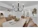 Open concept dining area with chandelier, view to living room and kitchen at 4309 King Valley Se Dr, Smyrna, GA 30082