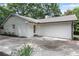 Charming home with a white painted brick exterior, attached garage and mature trees at 4309 King Valley Se Dr, Smyrna, GA 30082