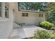 Exterior angle of the home with a white brick facade and concrete backyard patio at 4309 King Valley Se Dr, Smyrna, GA 30082