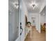 Bright foyer featuring gleaming hardwood floors and elegant light fixture at 4309 King Valley Se Dr, Smyrna, GA 30082
