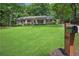 A home with a large front yard, a mailbox, and tasteful landscaping at 4309 King Valley Se Dr, Smyrna, GA 30082