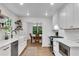Modern kitchen with white cabinets, stainless steel appliances and open shelving at 4309 King Valley Se Dr, Smyrna, GA 30082