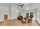 Comfortable living room with hardwood floors, cozy seating, and bright windows at 4309 King Valley Se Dr, Smyrna, GA 30082