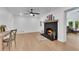 Cozy living room with fireplace, hardwood floors, and open access to other rooms at 4309 King Valley Se Dr, Smyrna, GA 30082