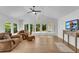 Bright living room with large windows, hardwood floors, and comfortable seating at 4309 King Valley Se Dr, Smyrna, GA 30082