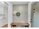 Charming mudroom with custom bench, storage, and stylish decor elements at 4309 King Valley Se Dr, Smyrna, GA 30082