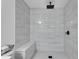 The renovated shower showcases white subway tile, bench seat, and sleek matte black fixtures at 4309 King Valley Se Dr, Smyrna, GA 30082