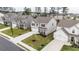 Aerial view showcasing a neighborhood featuring well-manicured lawns, long driveways, and beautiful two-story homes at 895 Garnet Dr, Acworth, GA 30101