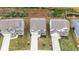 Birds-eye view of a house with a long driveway, surrounded by green lawns and other houses in the neighborhood at 895 Garnet Dr, Acworth, GA 30101