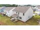 Backyard featuring a covered patio, with manicured lawn, and the rear exterior of this lovely two-story home at 895 Garnet Dr, Acworth, GA 30101