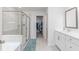 Elegant bathroom offering dual vanities, a glass shower, and soaking tub at 895 Garnet Dr, Acworth, GA 30101