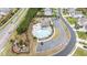 Aerial view of the neighborhood pool and amenity center, featuring a splash pool, seating, and parking at 895 Garnet Dr, Acworth, GA 30101