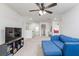 Spacious living room with blue sofa and modern media center perfect for entertaining at 895 Garnet Dr, Acworth, GA 30101