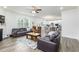 Bright, open living room with hardwood floors, a fireplace, and seamless access to the modern kitchen creating a warm, inviting space at 895 Garnet Dr, Acworth, GA 30101
