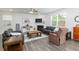 Inviting living room boasts hardwood floors, a fireplace, and lots of natural light at 895 Garnet Dr, Acworth, GA 30101