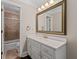 Bathroom featuring a white vanity with a large mirror and shower with glass door at 1120 Highland Bluff Se Dr, Atlanta, GA 30339