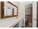 Well-lit bathroom with a vanity, a large mirror, and access to a separate toilet room at 1120 Highland Bluff Se Dr, Atlanta, GA 30339