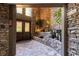 A naturally lit entryway featuring a stone wall and waterfall feature with lush plants at 1120 Highland Bluff Se Dr, Atlanta, GA 30339