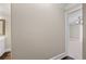 Hallway with neutral paint, white crown molding, and doorway to bedroom with ceiling fan at 1120 Highland Bluff Se Dr, Atlanta, GA 30339