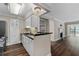 Kitchen area open to the living room, featuring stainless steel appliances and black countertops at 1120 Highland Bluff Se Dr, Atlanta, GA 30339