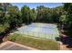 Aerial view of community tennis courts with green surroundings and fencing at 1120 Highland Bluff Se Dr, Atlanta, GA 30339