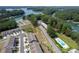 An aerial view of a lakeside neighborhood with an in-ground community pool at 2169 Lanier Harbor Pt, Buford, GA 30518