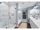 Contemporary bathroom featuring a glass enclosed shower, soaking tub, and double vanity at 2169 Lanier Harbor Pt, Buford, GA 30518