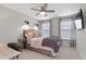 Bedroom featuring a neutral color scheme, ceiling fan, and television at 2169 Lanier Harbor Pt, Buford, GA 30518