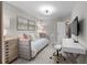 Comfortable bedroom with soft colors and a comfortable daybed, perfect for relaxation at 2169 Lanier Harbor Pt, Buford, GA 30518