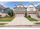 Beautiful townhome featuring a two-car garage, brick accents, well-maintained lawn, and inviting curb appeal at 2169 Lanier Harbor Pt, Buford, GA 30518