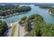 Breathtaking view of a lake with several boat docks surrounded by lush green trees at 2169 Lanier Harbor Pt, Buford, GA 30518