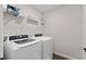 Bright laundry room featuring modern washer and dryer at 2169 Lanier Harbor Pt, Buford, GA 30518