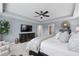 Spacious main bedroom featuring a ceiling fan, large dresser and neutral color palette at 2169 Lanier Harbor Pt, Buford, GA 30518