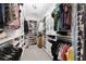 Organized walk-in closet offering ample storage space for clothing and accessories at 2169 Lanier Harbor Pt, Buford, GA 30518