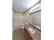 Bright bathroom featuring granite counters, stylish tile accents, and a shower-tub combination at 2189 Executive Dr, Duluth, GA 30096