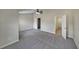 A spacious bedroom with neutral walls, carpet and ceiling fan at 2189 Executive Dr, Duluth, GA 30096