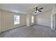 Bright bedroom with two windows offering natural light, carpet and ceiling fan at 2189 Executive Dr, Duluth, GA 30096