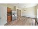 The dining area is adjacent to the kitchen, featuring stainless steel refrigerator and back staircase at 2189 Executive Dr, Duluth, GA 30096