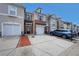 Charming townhome showcases a brick front, single-car garage, and a well-maintained driveway at 2189 Executive Dr, Duluth, GA 30096