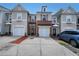 Charming townhome showcases a brick front, single-car garage, and a well-maintained driveway at 2189 Executive Dr, Duluth, GA 30096