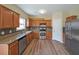 This stylish kitchen boasts granite countertops, stainless steel appliances, and ample cabinet space at 2189 Executive Dr, Duluth, GA 30096