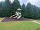 A neighborhood playground with slides and climbing area surrounded by dense trees at 2189 Executive Dr, Duluth, GA 30096