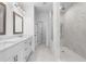 Bathroom features a double vanity and a glass-enclosed shower with marble tile at 628 Skytop Dr # 158, Cumming, GA 30040
