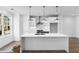 Stylish kitchen boasts a center island, stainless steel appliances, and a bright, airy atmosphere at 628 Skytop Dr # 158, Cumming, GA 30040